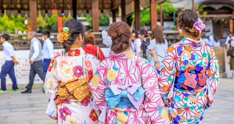 Travelers in Kimono in the Yasaka Shrine in Kyoto