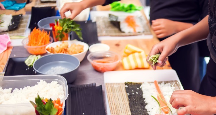 making sushi at a local home in Japan
