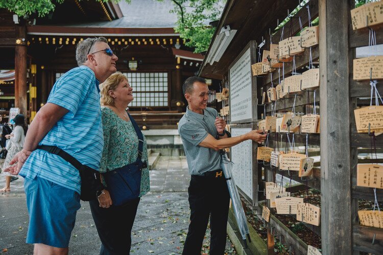 Travelers with their guide in Meiji Shrine