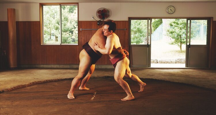 Sumo Wrestling in Ring of Arena