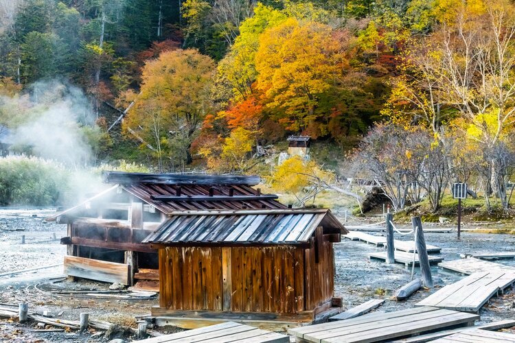 Old wooden bathhouses in the swamp at Yumoto Onsen