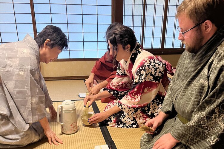 family take part in hands-on tea experience in Japan