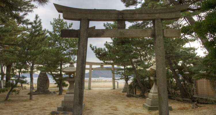 Shinto shrine and Torii stone gates near the beach on Megijima Island