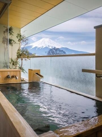 Stay in a traditional onsen ryokan with a private Fuji-view bath for an authentic cultural escape